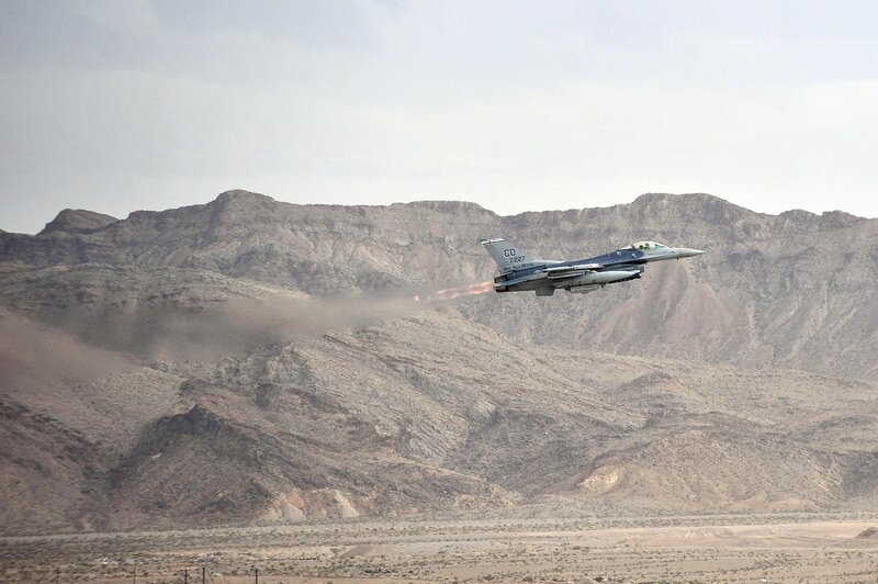 F-16 Fighter Jet — Gray, Dramatic, Afternoon, Photograph, Mountains, Desert