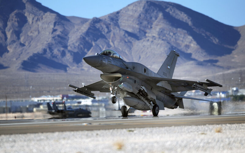 F-16 Fighter Jet — Gray, Dramatic, Afternoon, Photograph, Mountains, Runway