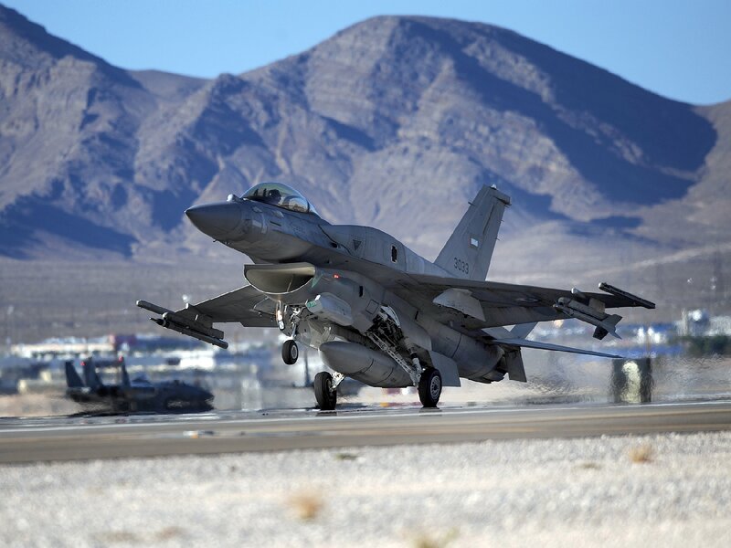 F-16 Fighter Jet — Gray, Dramatic, Afternoon, Photograph, Runway, Mountains