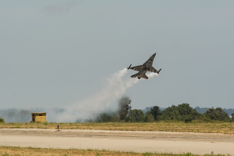 F-16 Fighter Jet — Gray, Dramatic, Afternoon, Photograph, Smoke
