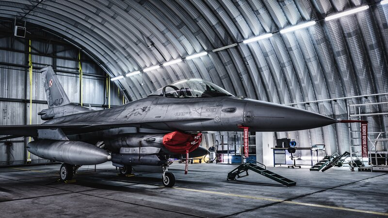 F-16 Fighter Jet — Gray, Dramatic, Photograph, Hangar