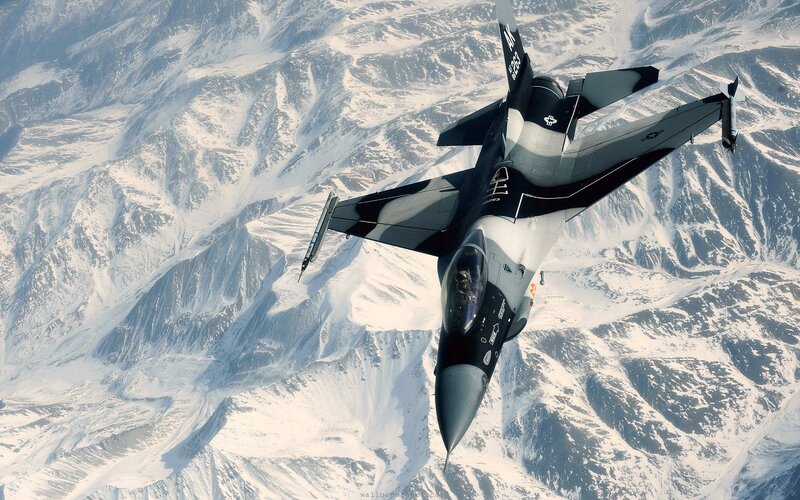F-16 Fighter Jet — Gray, Dramatic, Winter, Photograph, Snow-covered Mountains