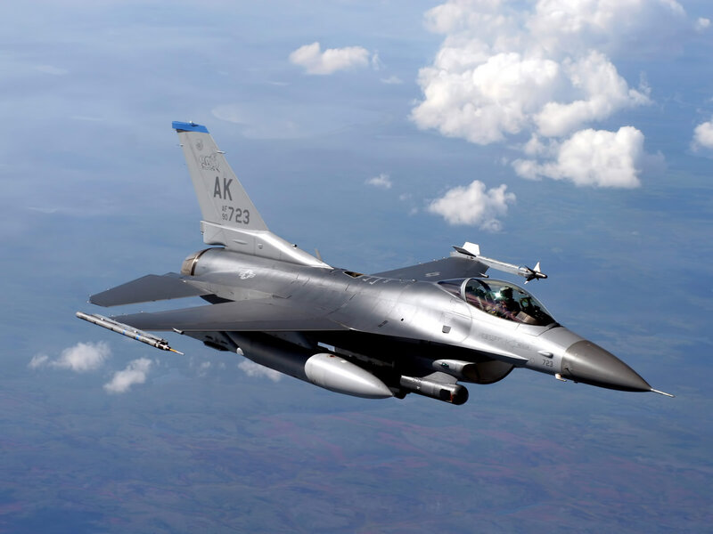 F-16 Fighter Jet — Gray, Dynamic, Afternoon, Photograph, Clouds