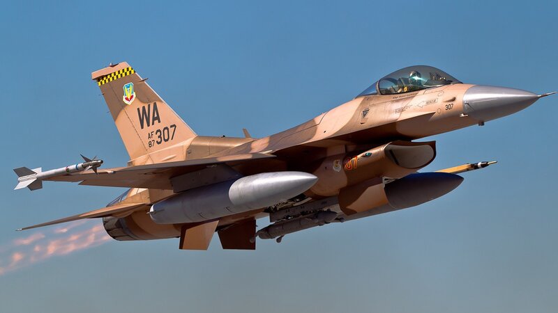 F-16 Fighter Jet in Flight — Tan, Dynamic