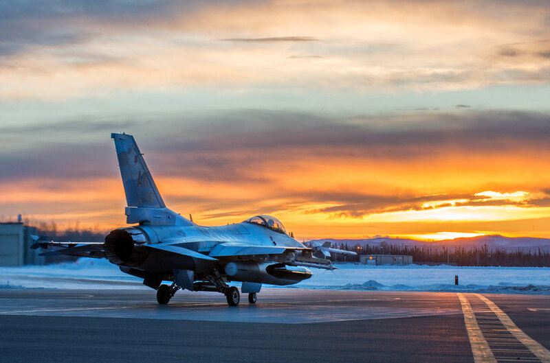 F-16 Fighter Jet on Runway — Orange