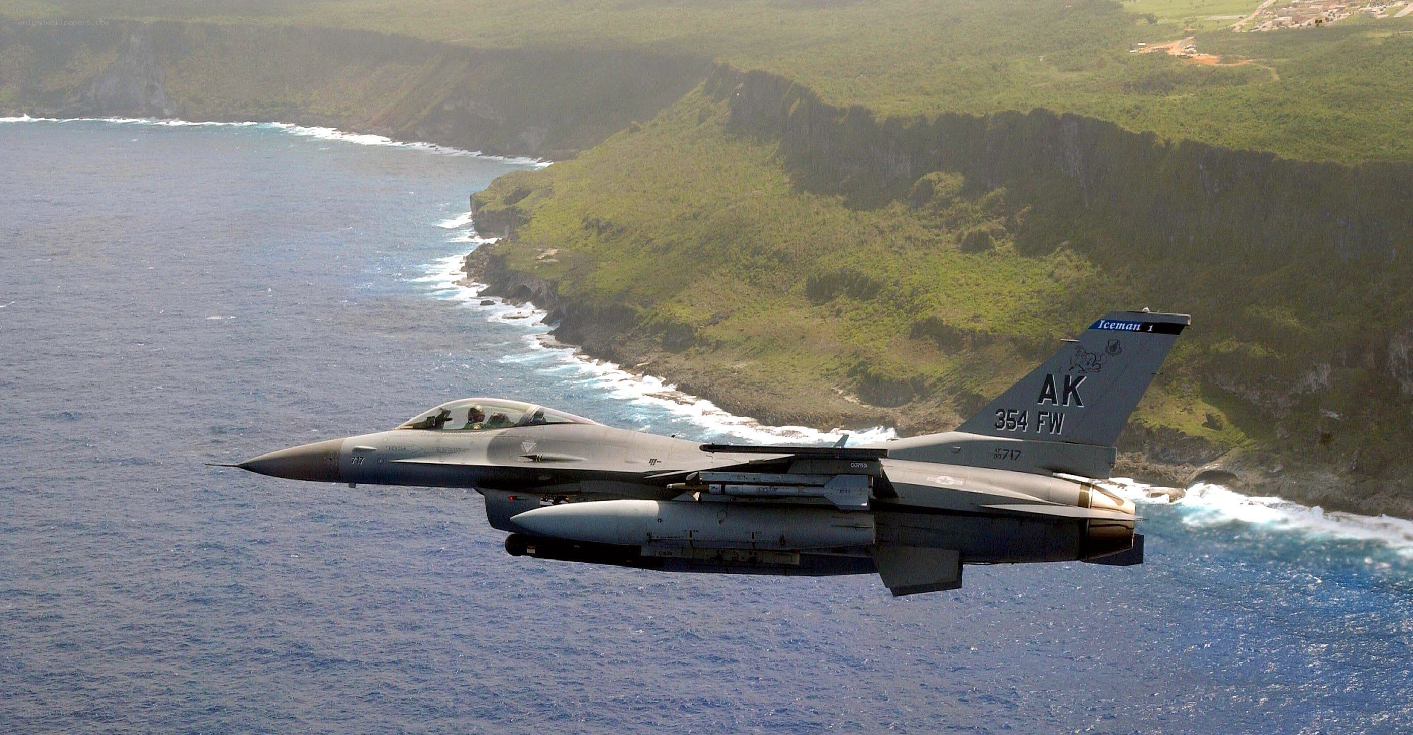 F-16 fighter jet over coastline