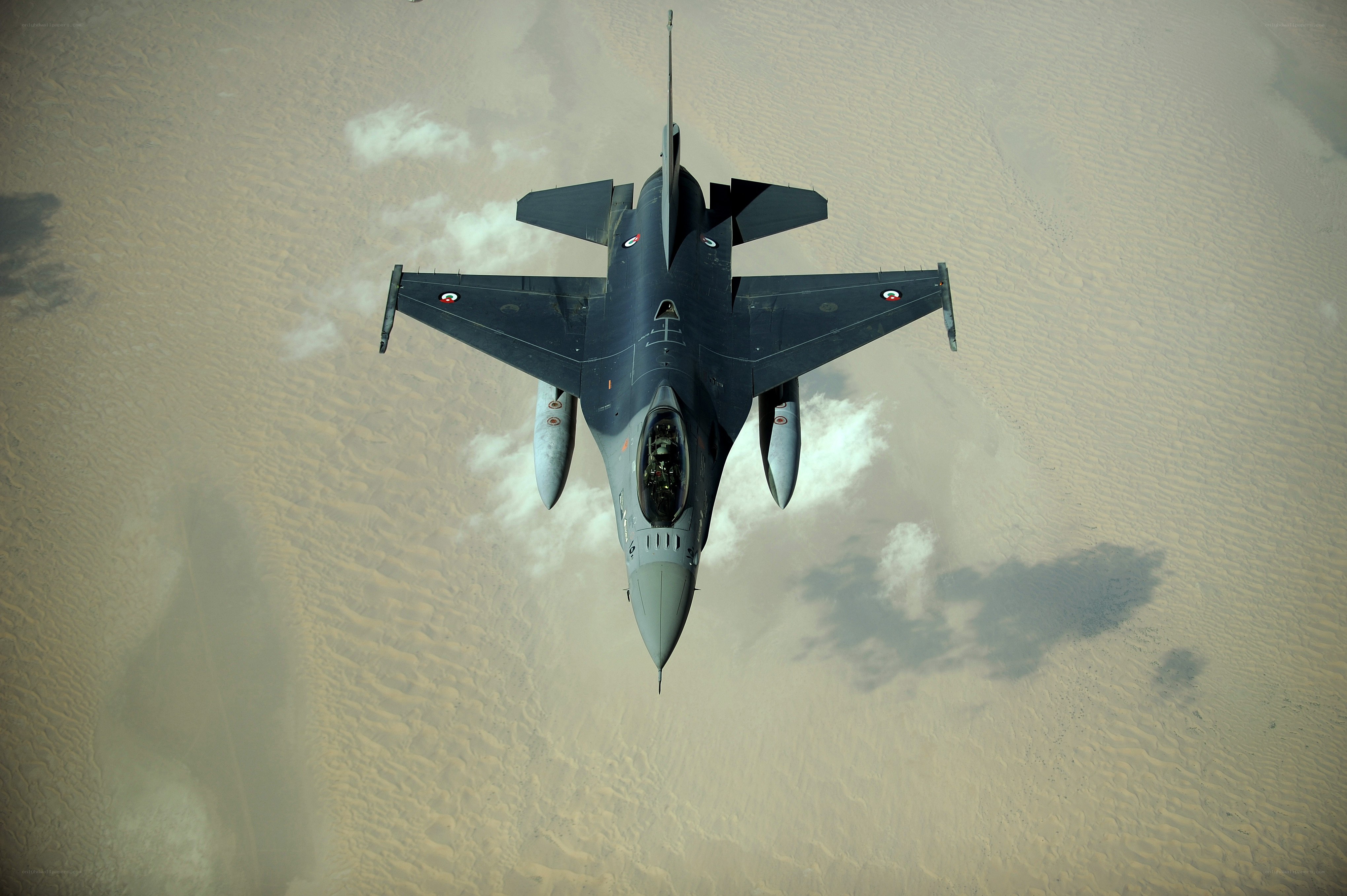 F-16 fighter jet over desert