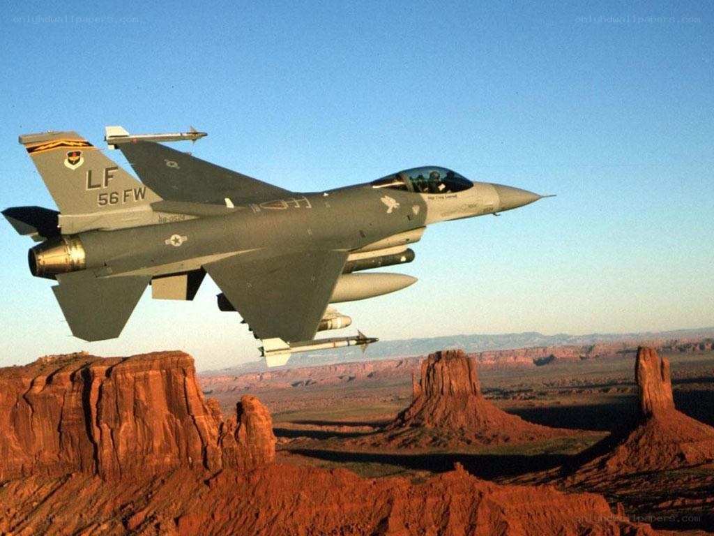 F-16 fighter jet over desert