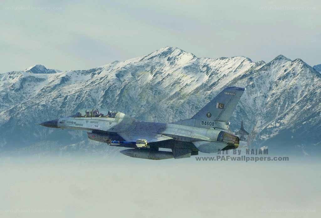 F-16 fighter jet over mountains