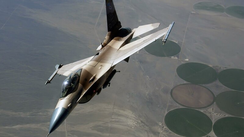 F-16 Fighter Jet — Tan, Aerial, Afternoon