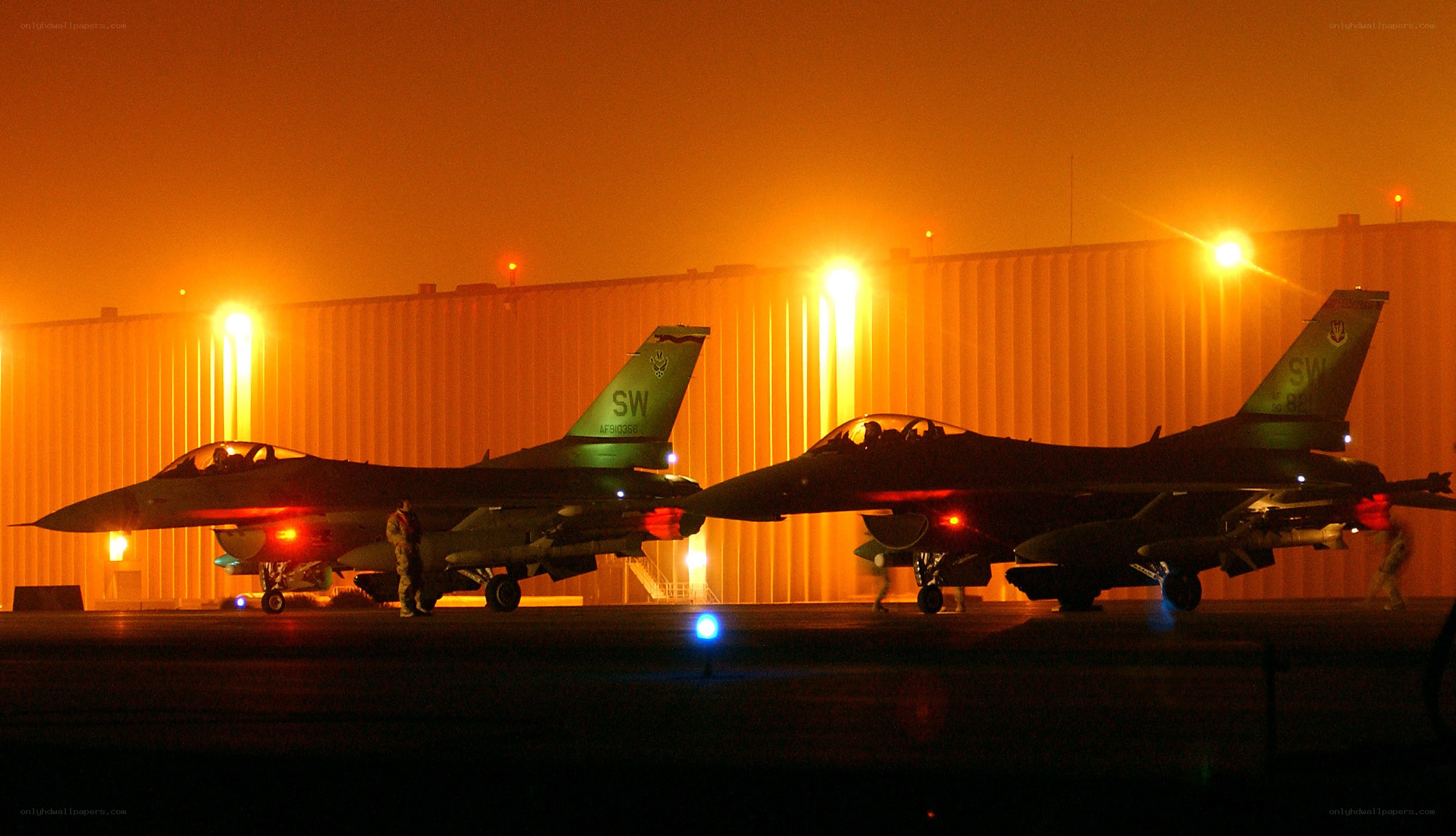 F-16 fighter jets at night