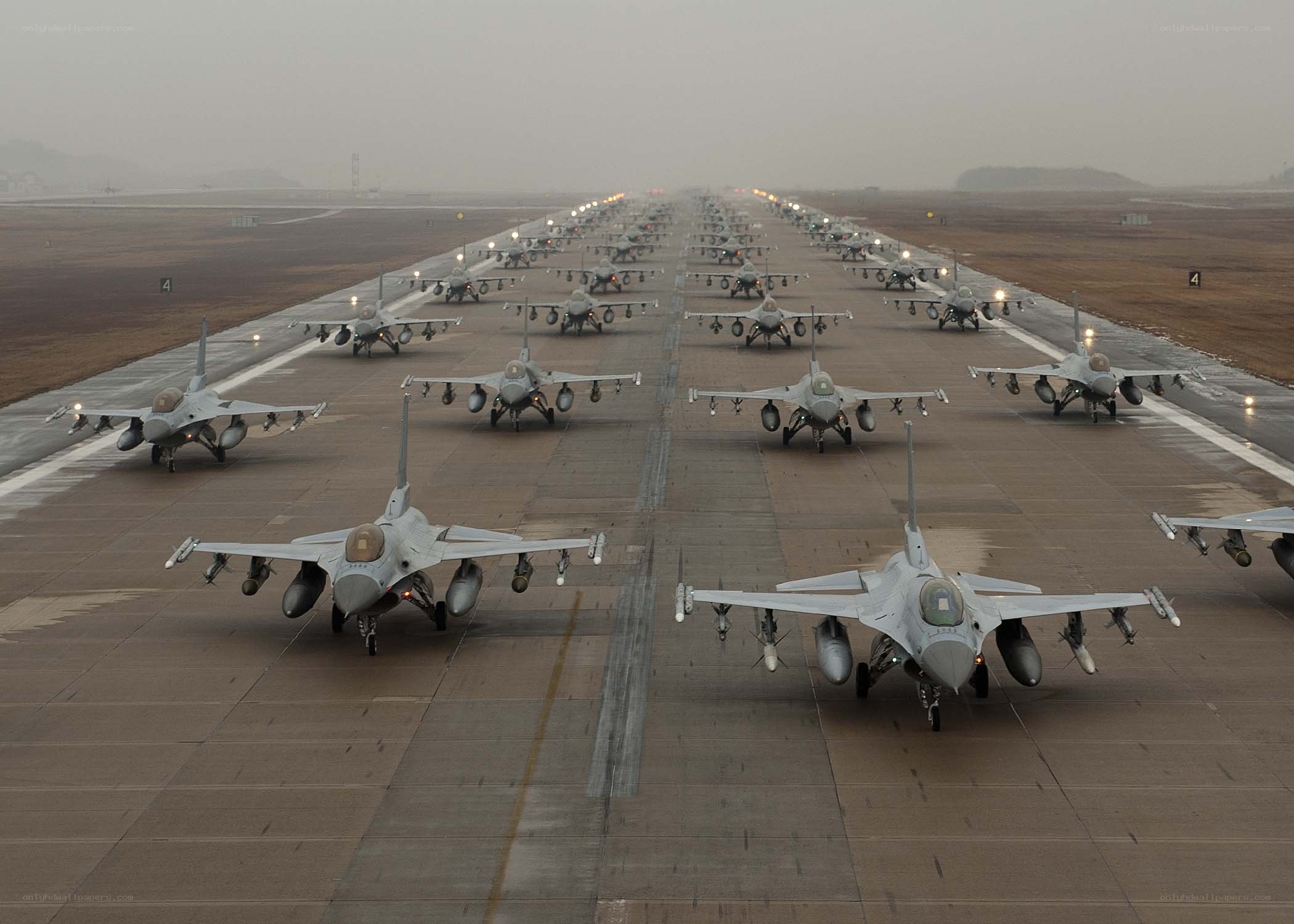 F-16 fighter jets on a runway