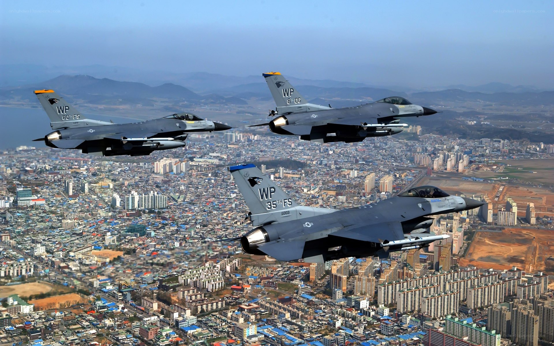 F-16 fighter jets over city