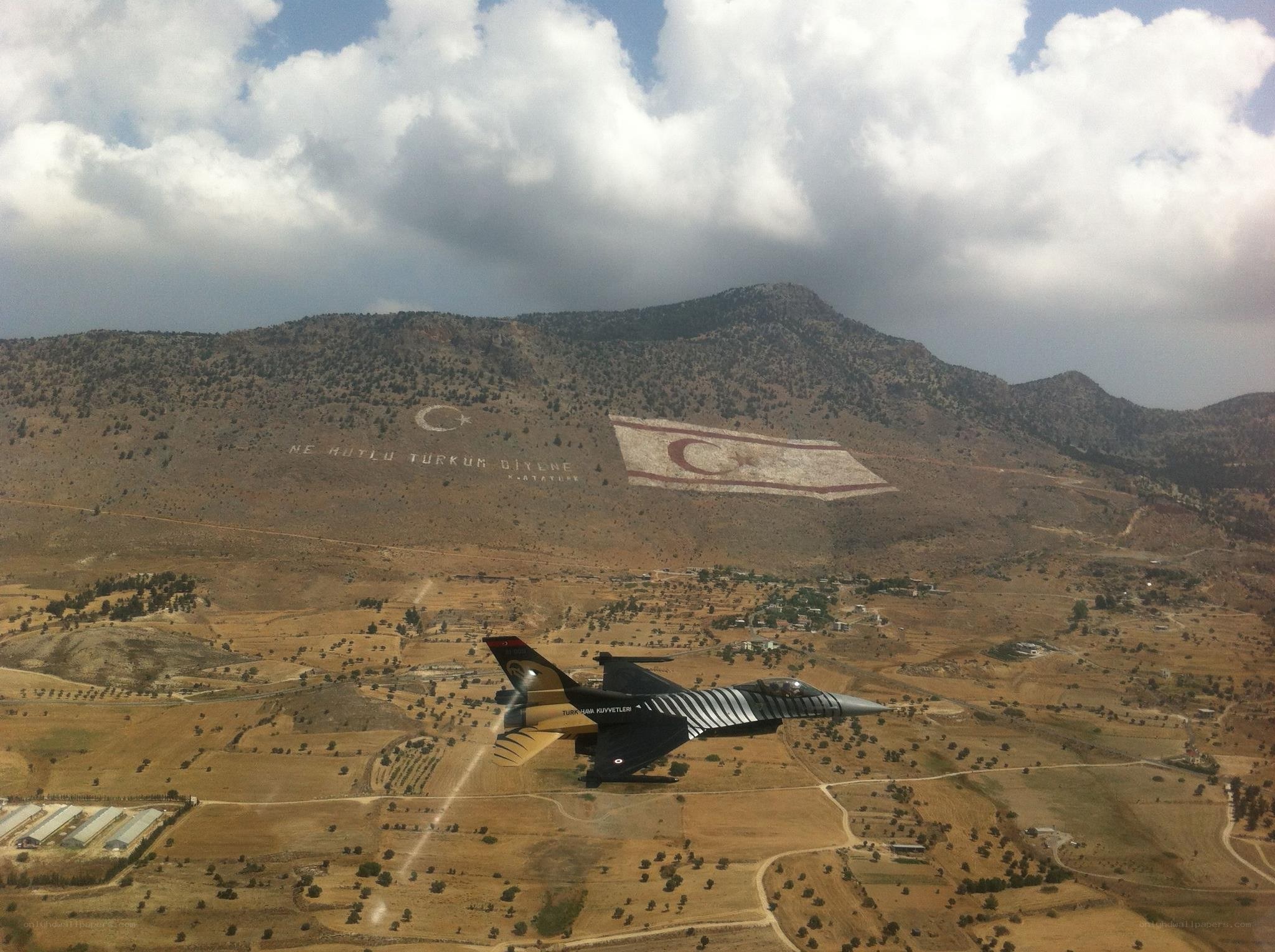 F-16 flying over Turkish flag mountain