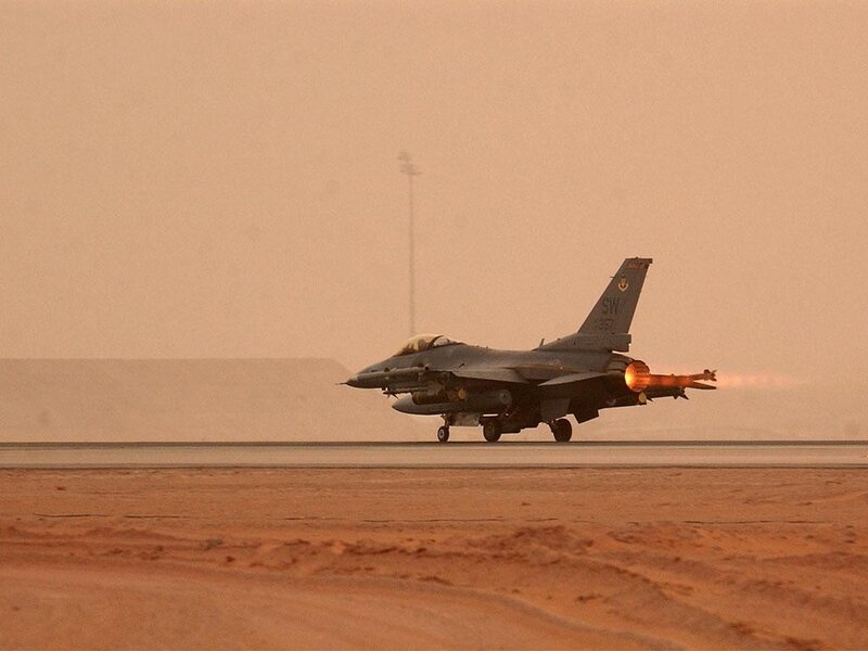 F-16 jet on desert runway