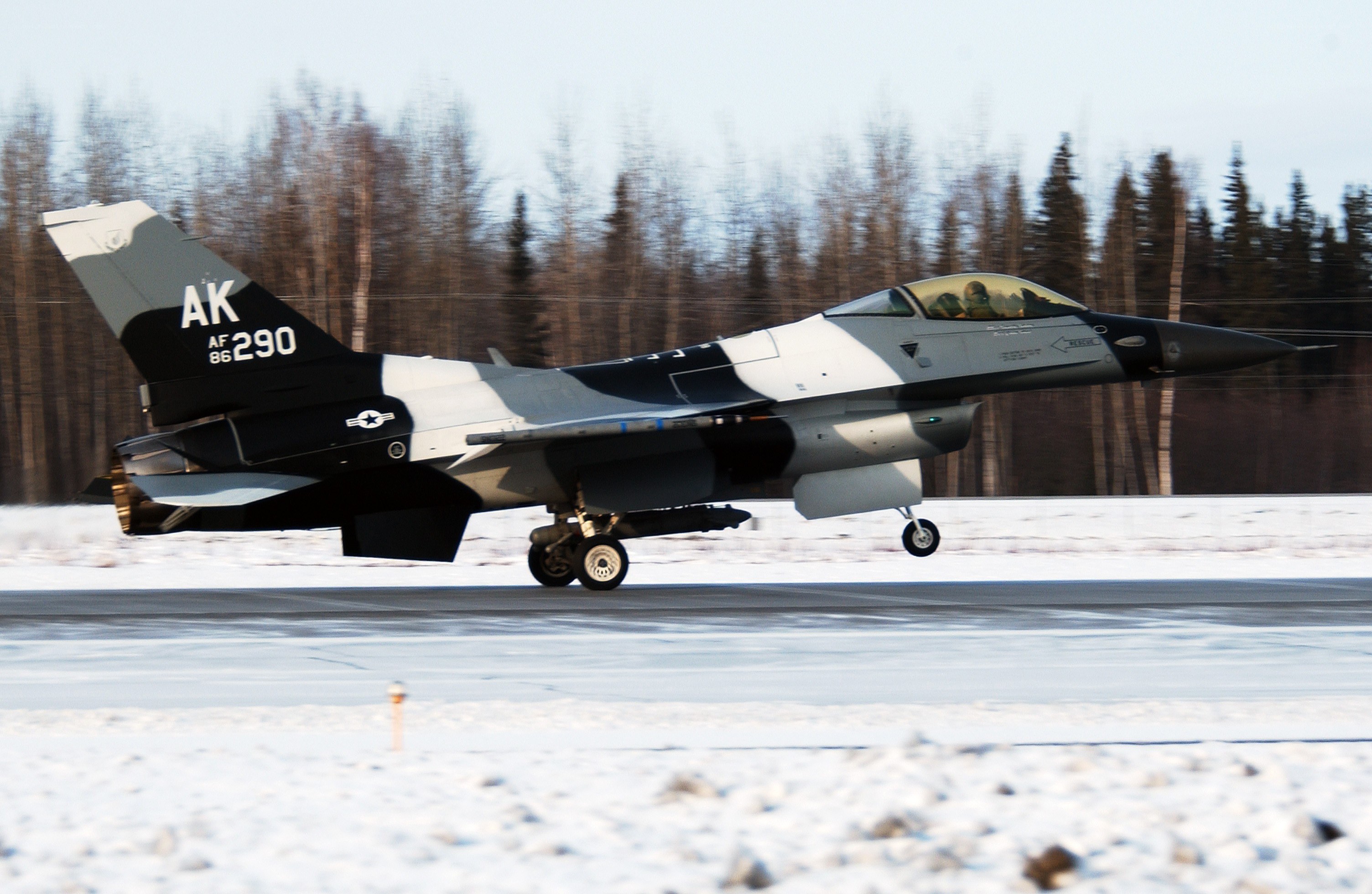 F-16 jet on snowy runway