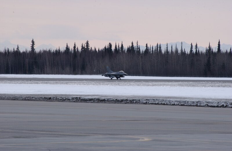 F-16 jet on snowy runway