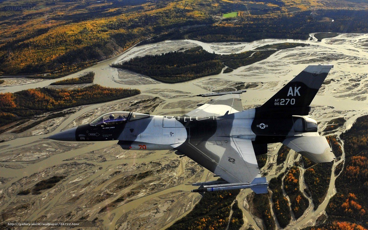 F-16 jet over autumn landscape