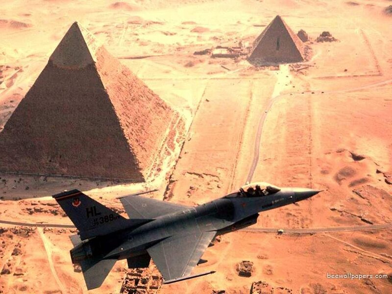 F-16 jet over pyramids