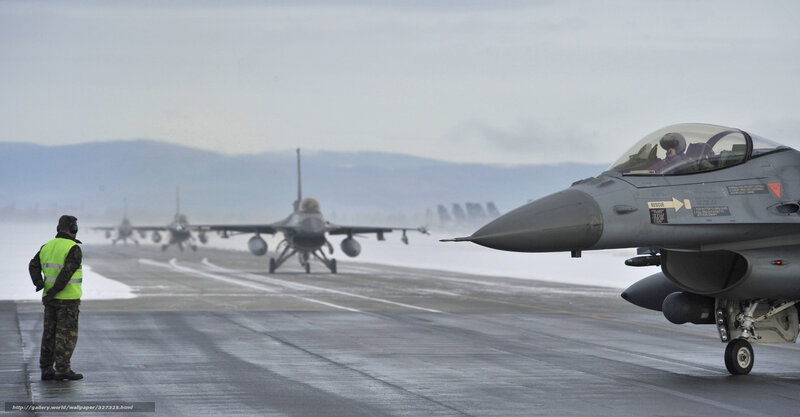 F-16 jets on snowy runway