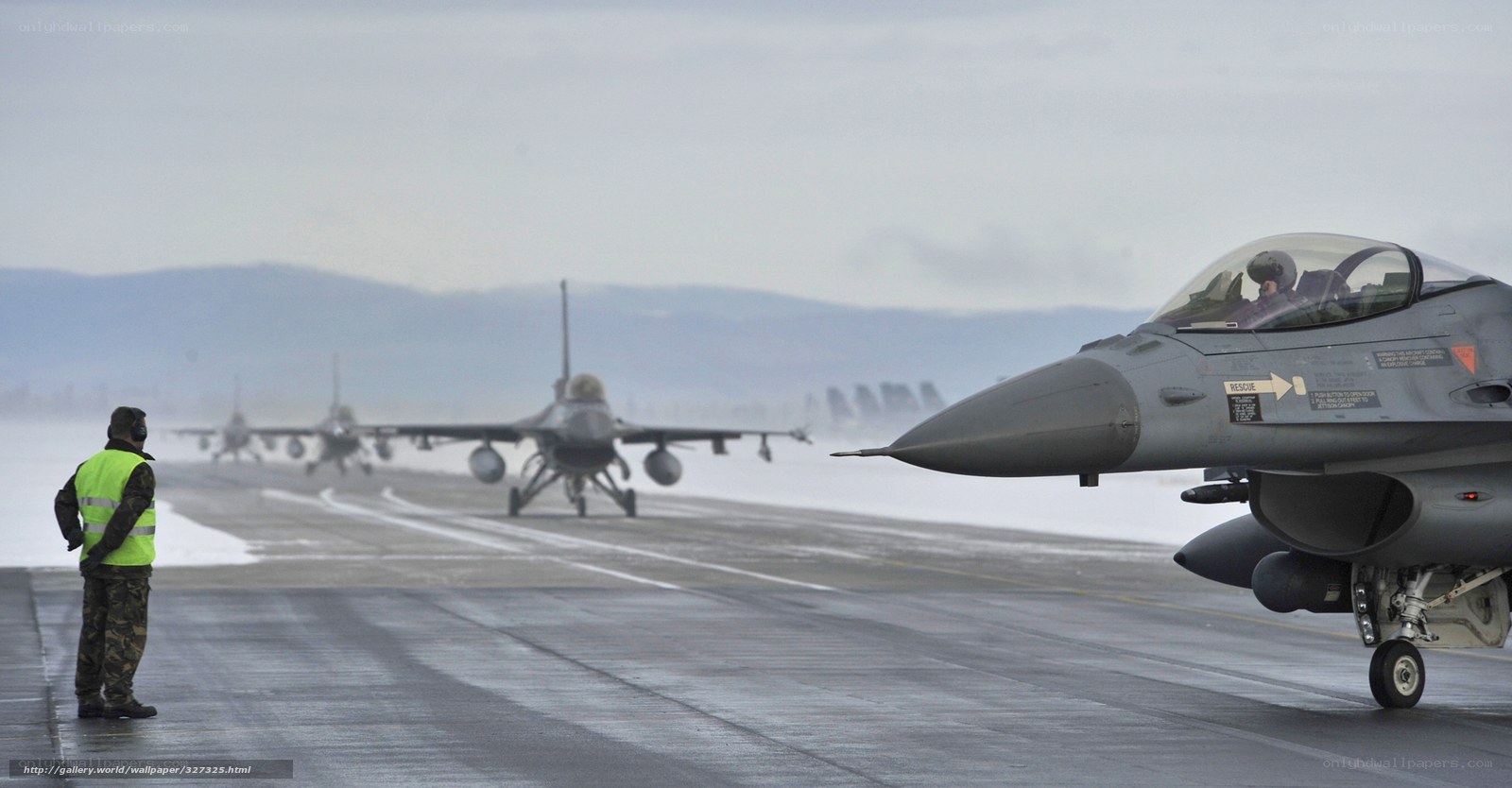 F-16 jets on snowy runway