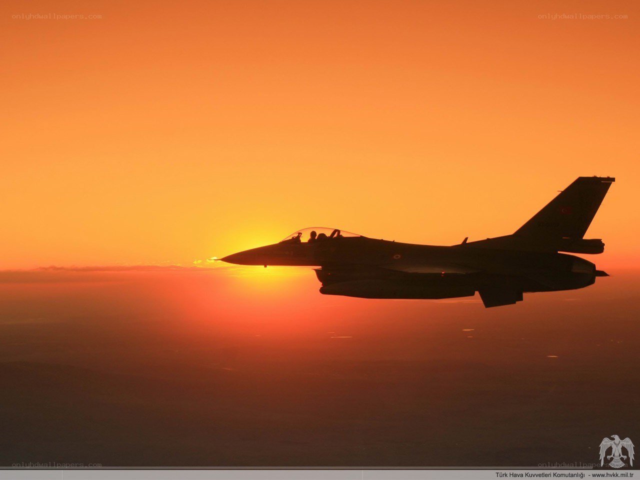F-16 silhouette at sunset