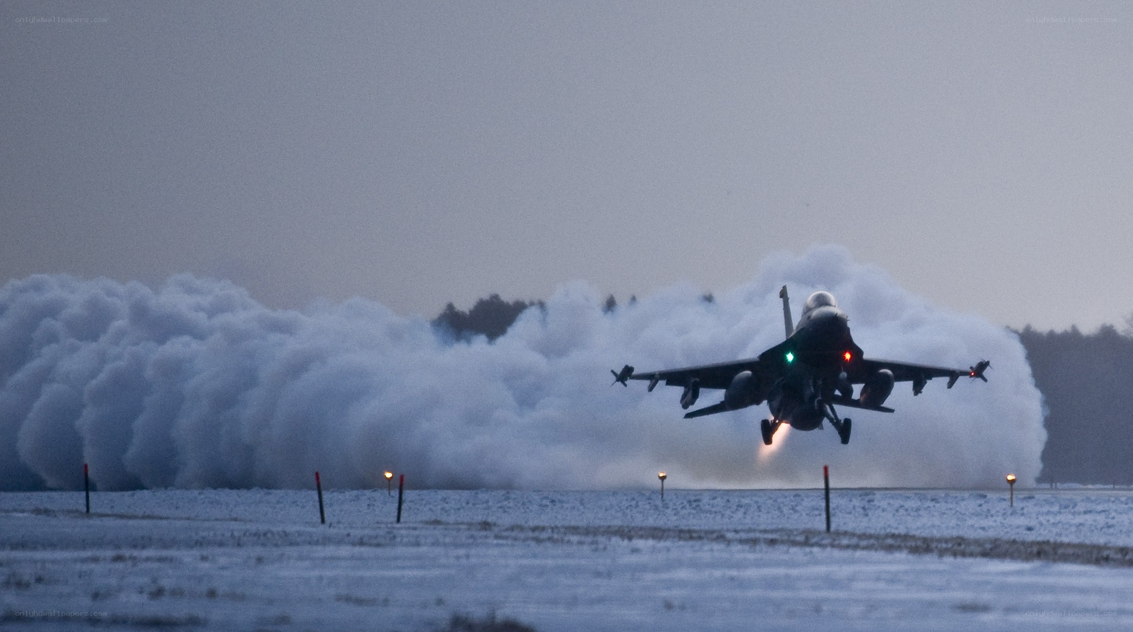 F-16 taking off in snow