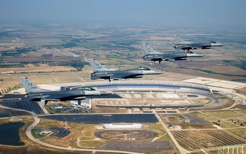 F-16s flying over a racetrack