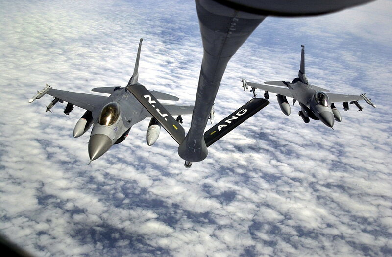 F-16s refueling in flight