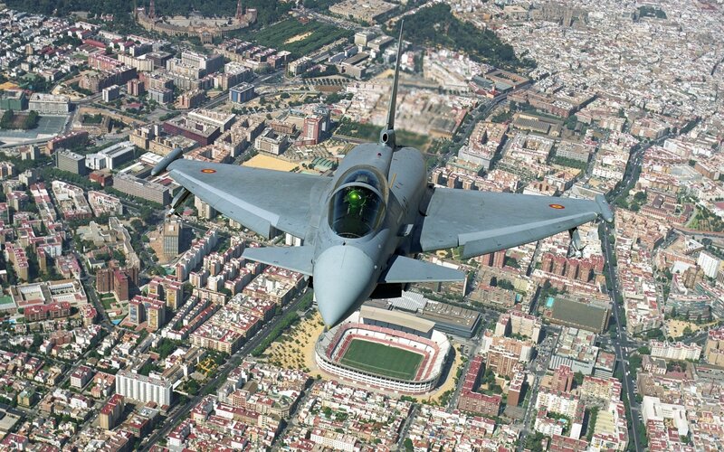 F-18 fighter jet over city
