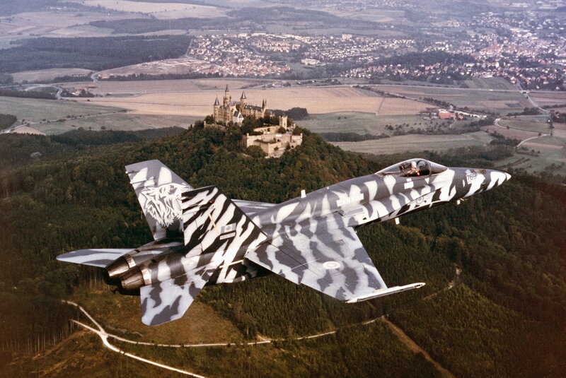 F-18 jet over castle