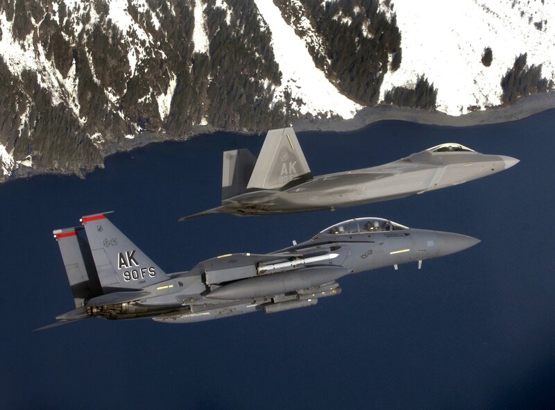 F-22 and F-15 fighter jets in flight