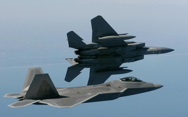 F-22 and F-15 in formation
