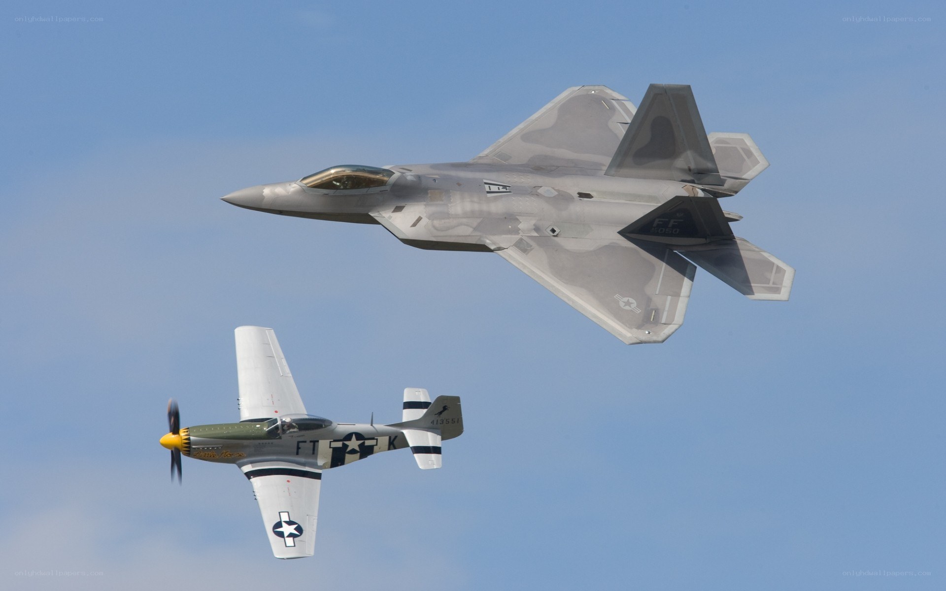 F-22 and P-51 in flight