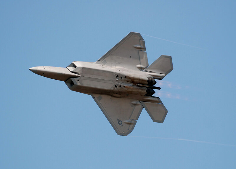 F-22 Raptor Fighter Jet — Blue, Dynamic, Afternoon, Photograph, Jet Engine Exhaust, Sky, Gray