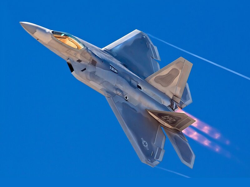 F-22 Raptor Fighter Jet — Blue, Dynamic, Photograph