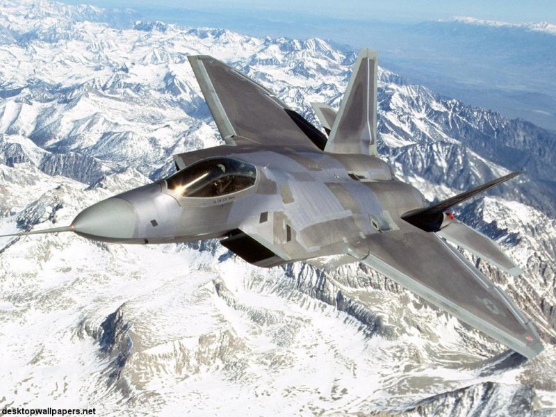 F-22 Raptor Fighter Jet — Gray, Dramatic, Photograph, Snow-covered Mountains