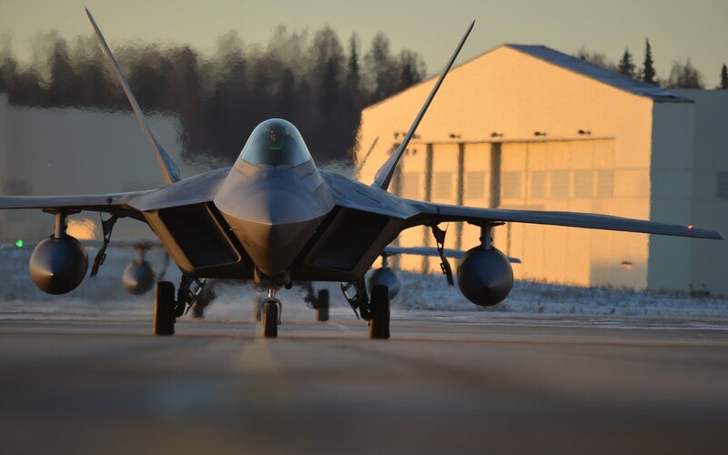 F-22 Raptor Fighter Jet — Gray, Dramatic, Sunset, Photograph, Airplane Hangar