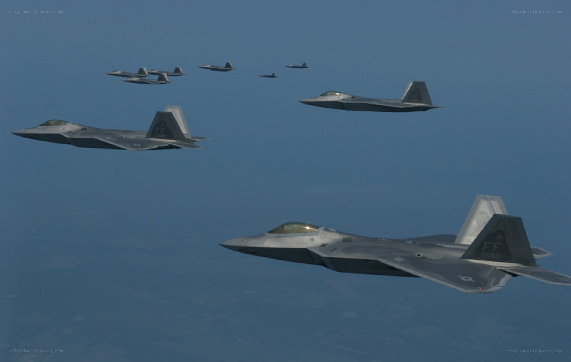 F-22 Raptor fighter jets in formation