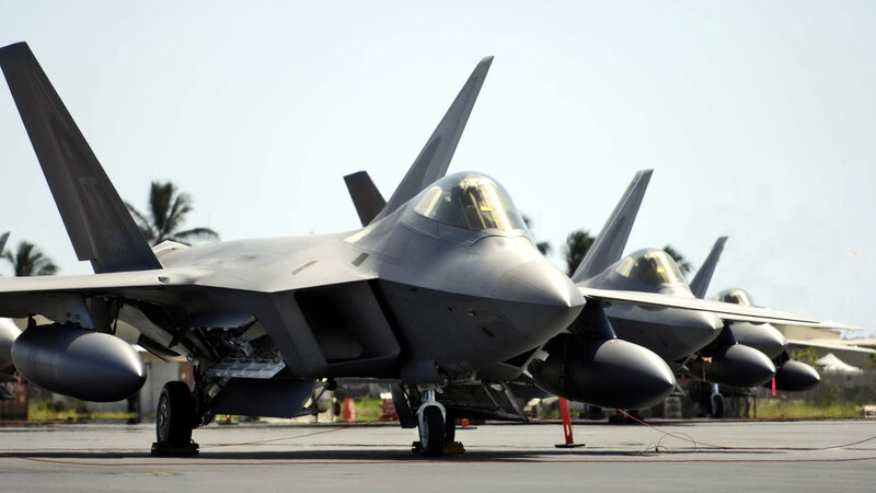 F-22 Raptor fighter jets on tarmac