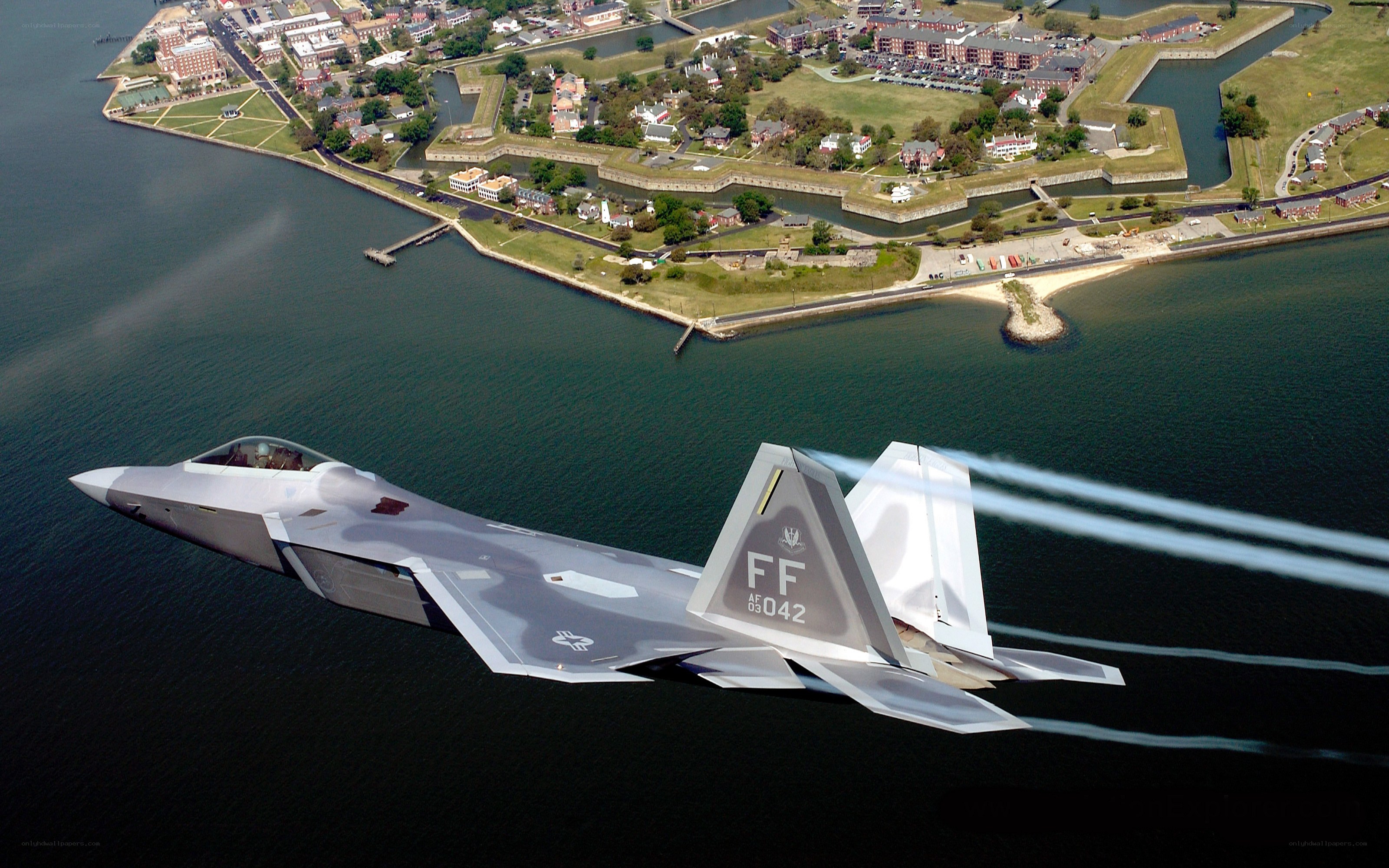 F-22 Raptor flying over water