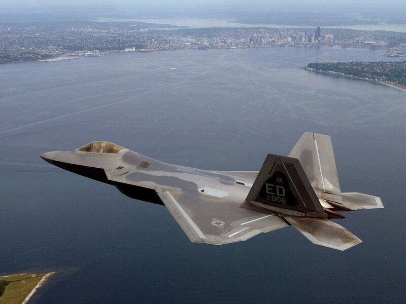 F-22 Raptor flying over water