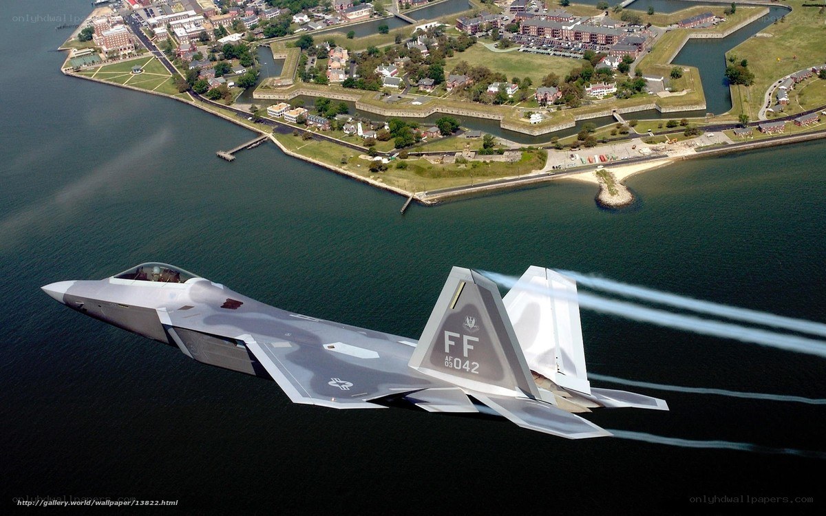 F-22 Raptor flying over water