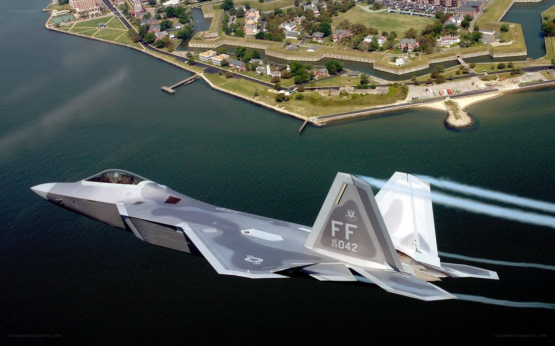 F-22 Raptor in flight over water