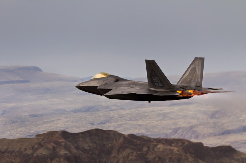 F-22 Raptor Jet — Gray, Dramatic, Sunset, Photograph, Mountains