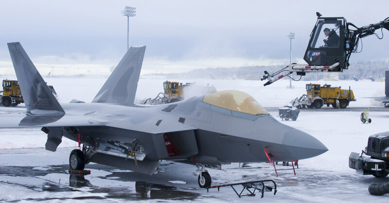 F-22 Raptor on snowy tarmac