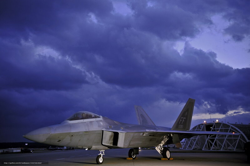 F-22 Raptor on tarmac at dusk