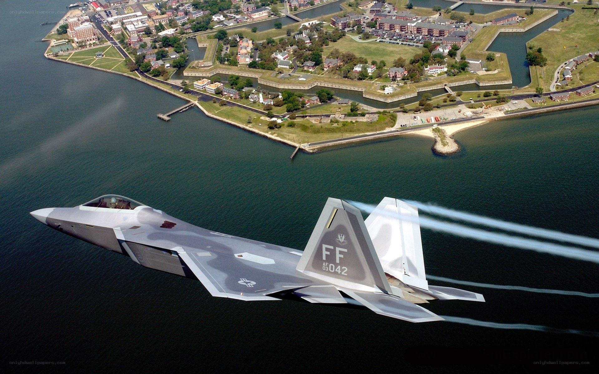 F-22 Raptor over coastal base