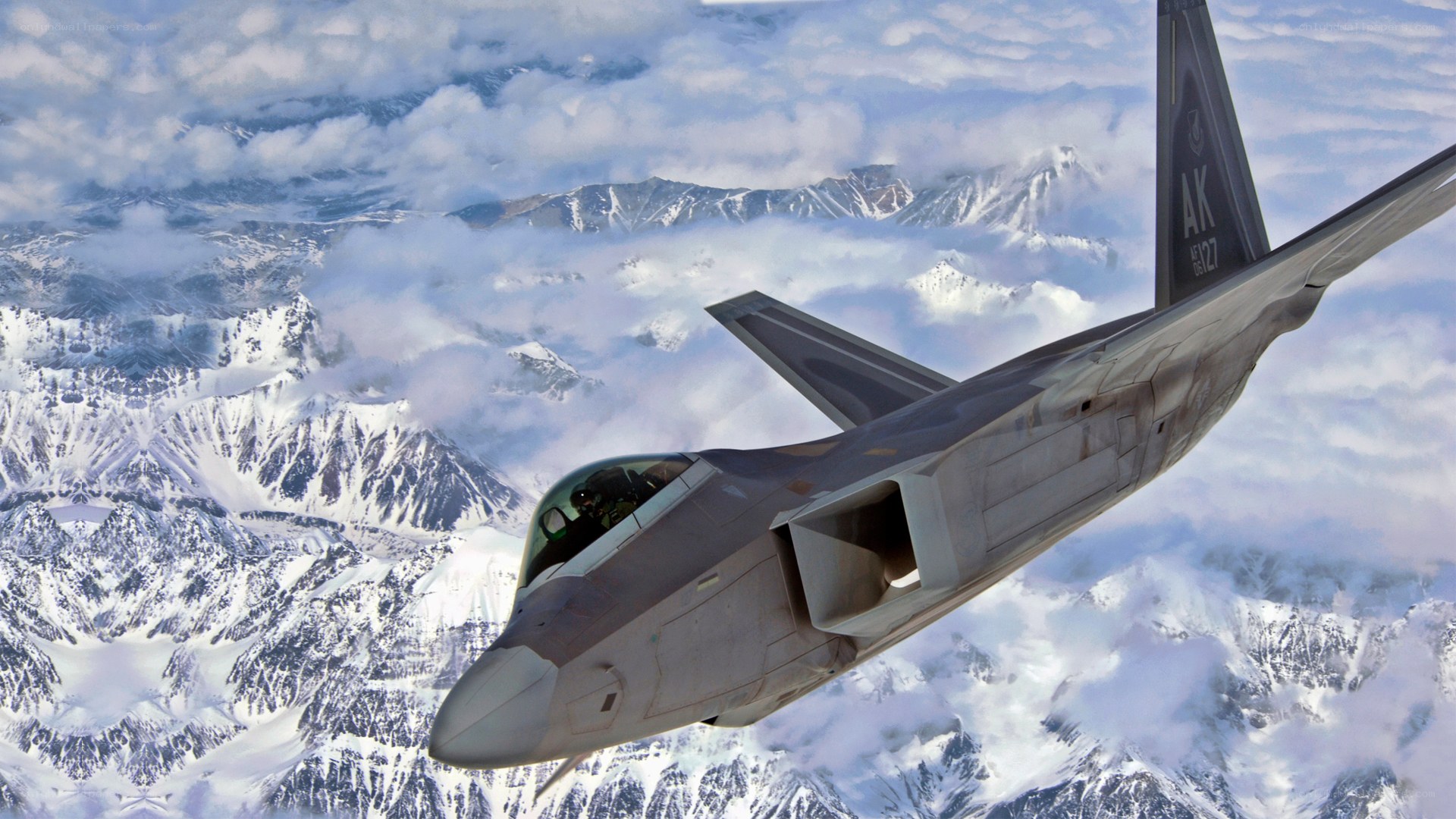 F-22 Raptor over snowy mountains
