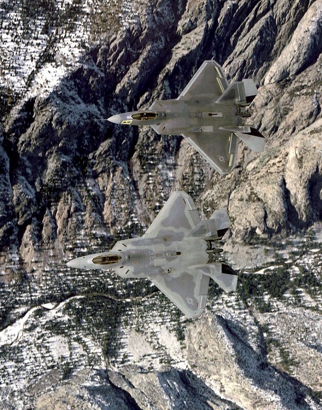 F-22 Raptors over mountains